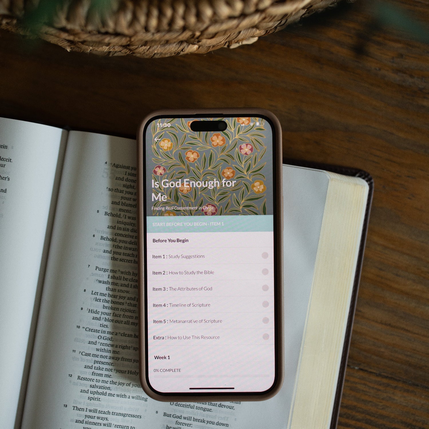 Cell phone on a Bible with Digital Bible study on the screen