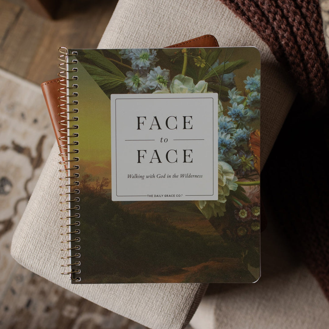 Face to Face Spiral Study cover on a bible on a couch 