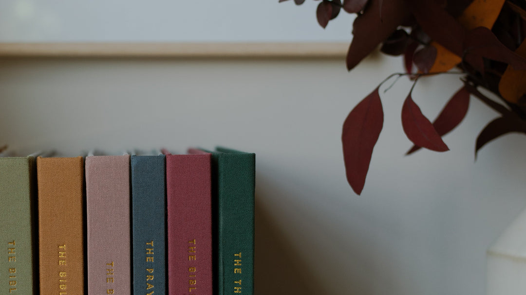 Stack of Bible Reference books on table